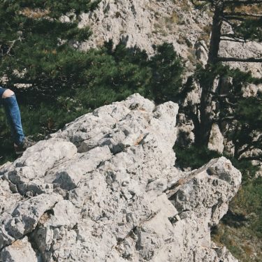 Girl on rocks of Ai-Petri mountain